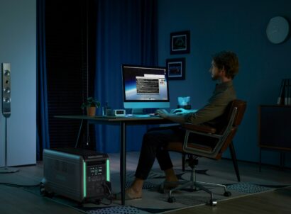 a man sitting at a desk in front of a computer